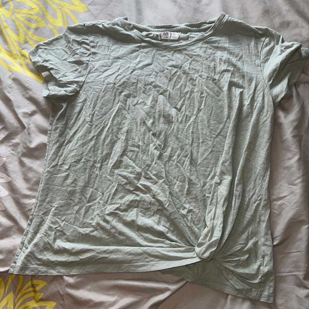 Maurice’s light green top